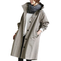 Trench-coat imperméable pour femme au design contemporain, idéal pour un usage quotidien