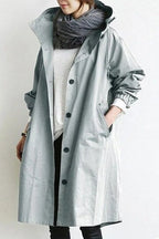 Trench-coat imperméable pour femme au design contemporain, idéal pour un usage quotidien